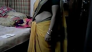 Desi aunty flaunts her hidden desire, stripping down to reveal her sensual curves beneath her saree.