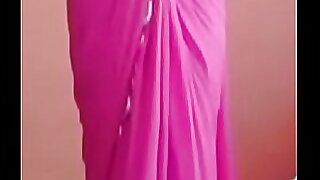 A group of sultry Desi ladies put on a tantalizing show, sensually unveiling their curves beneath their colorful sarees.
